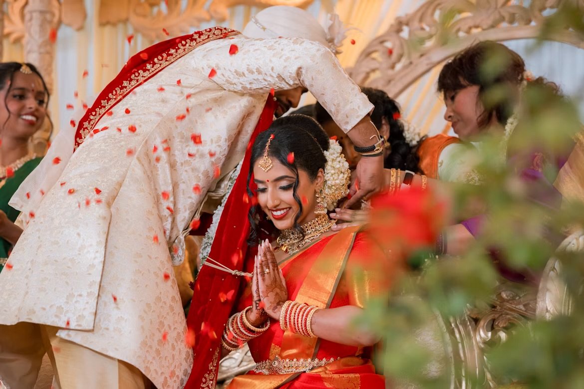 The thaali being tied as petals fall